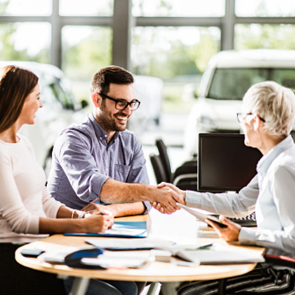 Man shaking hands with salesperson