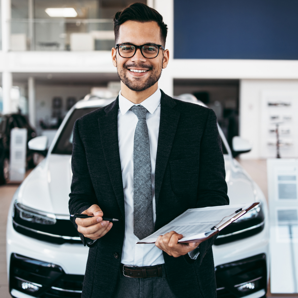 Car salesman in showroom