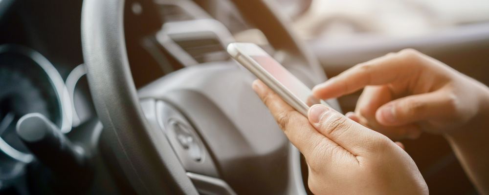 Person texting in their car