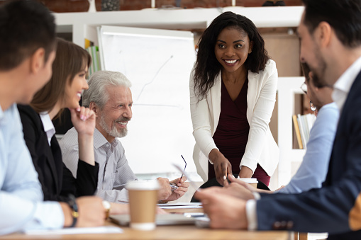 Woman giving presentation in a meeting