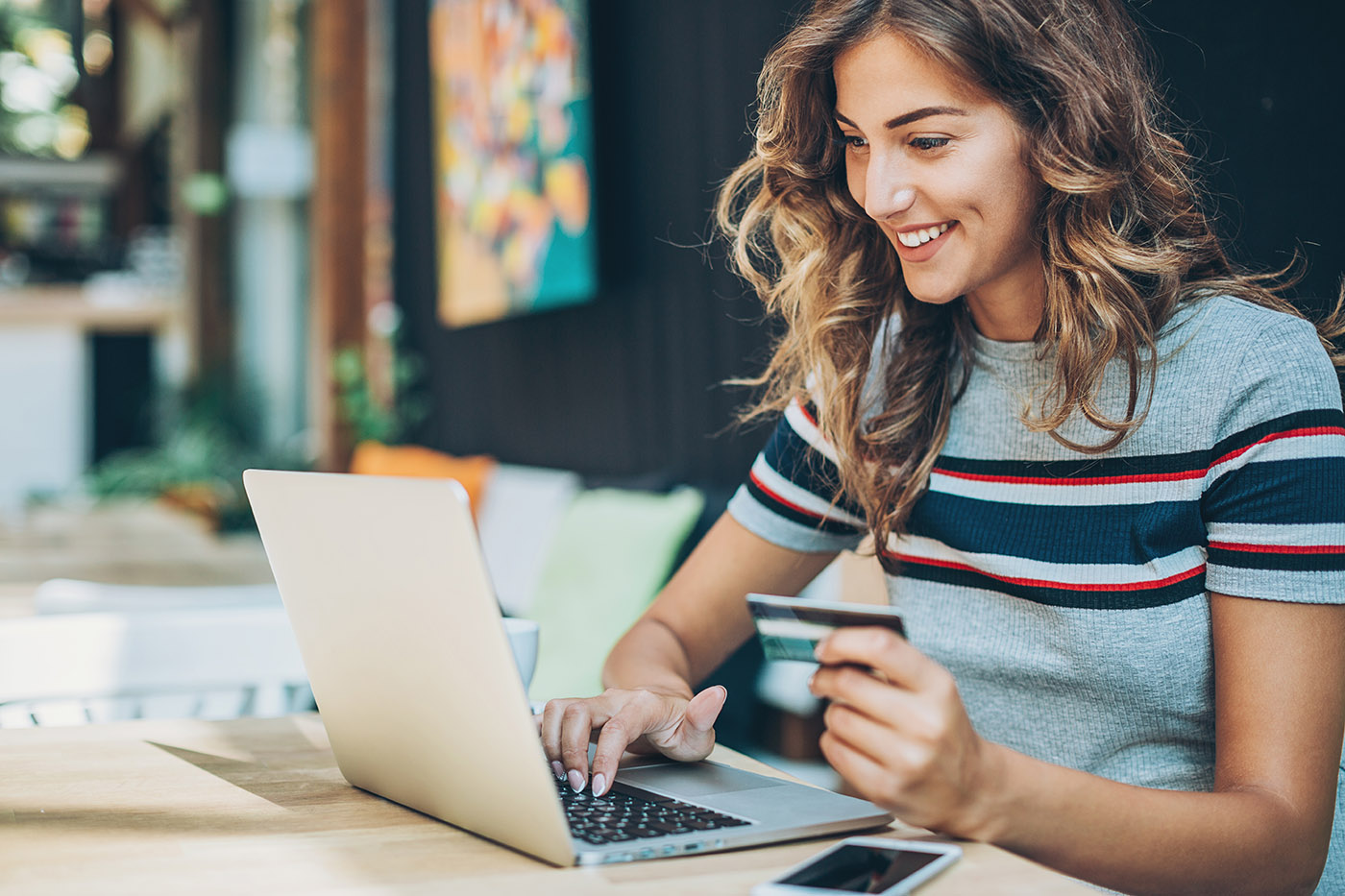 Woman making a payment on a laptop